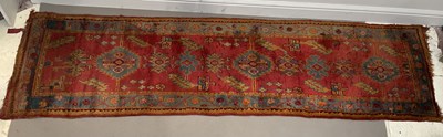 Lot 279 - A decorative Eastern runner with stylised...