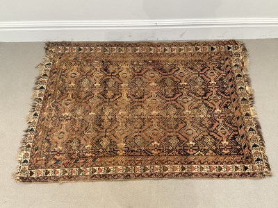 Lot 1417 - A late 19th century Eastern rug with stylised...