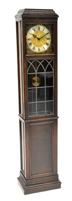 Lot 105 - SCHUTZ; an oak cased grandmother clock, height...