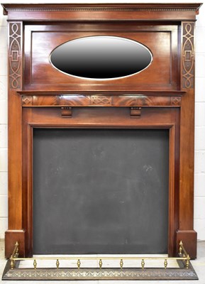 Lot 77 - A mahogany fire surround, the moulded cornice...