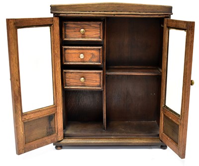 Lot 235 - An early 20th century oak smoker's cabinet,...