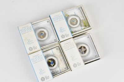 Lot 656 - THE ROYAL MINT; four Beatrix Potter and Her...