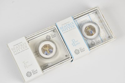 Lot 724 - THE ROYAL MINT; two Beatrix Potter and Her...