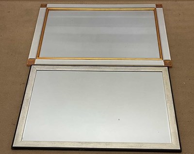 Lot 737 - Two modern bevelled edged mirrors, comprising...