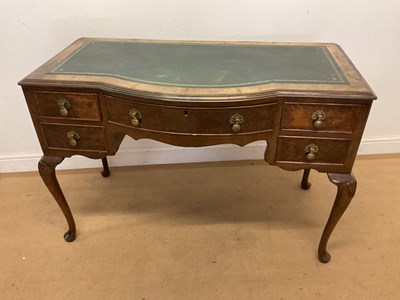 Lot 706 - A bowfronted five drawer writing desk with...