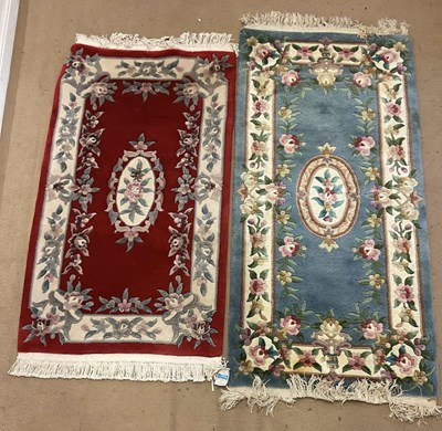 Lot 807 - Two Oriental machine woven rugs, both with...