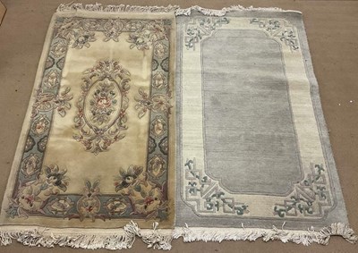 Lot 811 - Two machine woven Chinese rugs, comprising a...