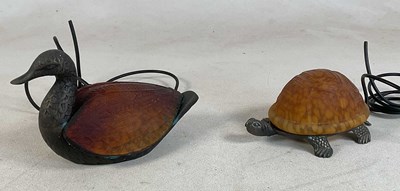 Lot 663 - Two cast brass and mottled glass lamps in the...