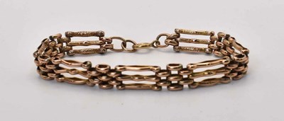 Lot 577 - A 9ct gold gatelink bracelet, 10.8g.
