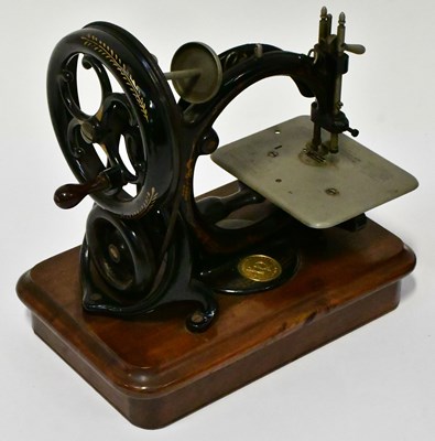 Lot 248 - WILLCOX & GIBBS; a vintage portable sewing...