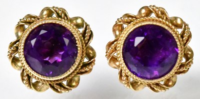Lot 834 - A pair of 9ct yellow gold earrings set with...