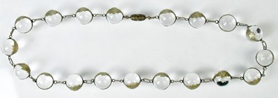Lot 828 - A necklace of clear quartz beads in...