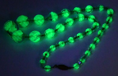 Lot 829 - A single-strand blue and green Uranium glass...