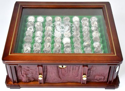 Lot 611 - DANBURY MINT; a cased set of uncirculated US...