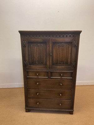 Lot 785 - An oak cupboard, with two linen fold decorated...