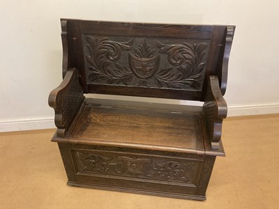 Lot 786 - A 19th century carved oak monk's bench, height...