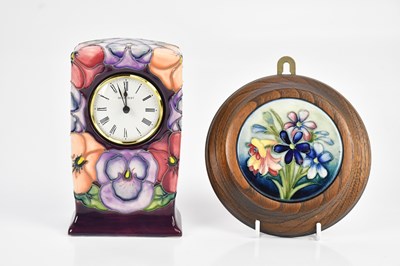 Lot 1577 - MOORCROFT; a lid decorated in the 'Spring...