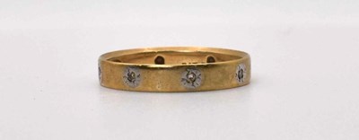 Lot 612 - A 9ct gold white stone eternity ring, size M,...