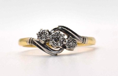 Lot 590 - A 18ct gold and platinum three stone diamond...