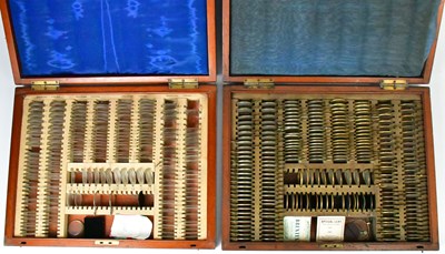 Lot 337 - Two vintage wooden cased optician lens sets (2).