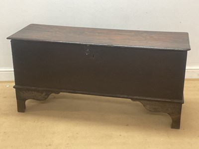 Lot 846 - An 18th century oak coffer on scrolled...