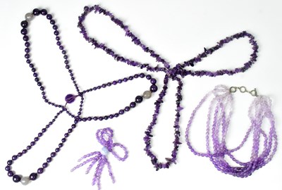 Lot 830 - Three beaded amethyst necklaces, comprising a...