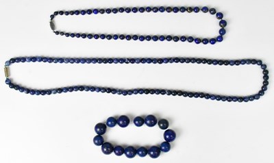 Lot 827 - Two lapis lazuli beaded necklaces, comprising...