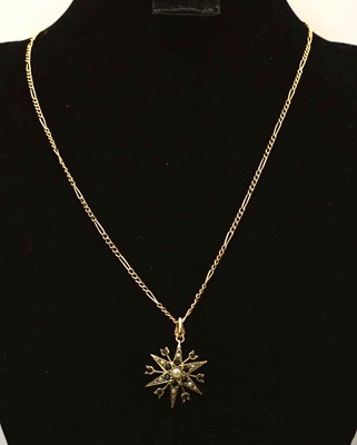 Lot 585 - A 9ct gold sapphire and seed pearl sunburst...