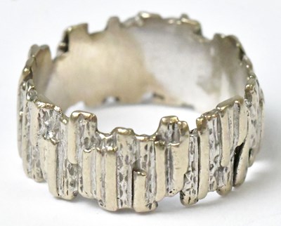 Lot 708 - An 18ct white gold bark-effect ring, size N,...
