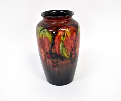 Lot 654 - MOORCROFT; a grape pattern vase of shouldered...