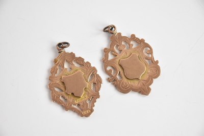 Lot 477 - Two 9ct rose gold medallions/medals, combined...