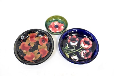 Lot 653 - MOORCROFT; a poppy pattern dish with impressed...