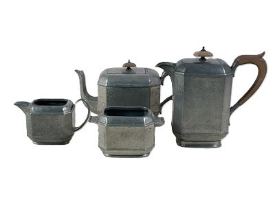 Lot 649 - ABBEY PEWTER; an Art Deco pewter four piece...