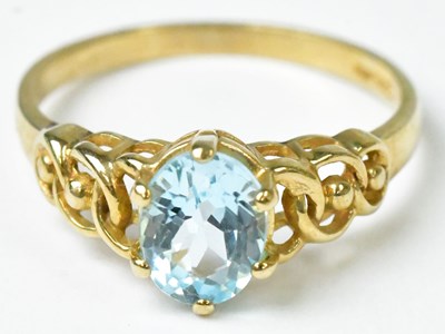 Lot 741 - A 9ct yellow gold ring set with a pale blue...
