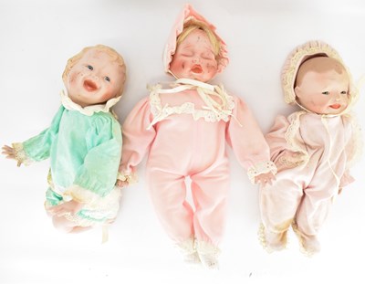 Lot 214 - ASHTON DRAKE; three porcelain dolls comprising...