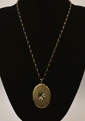 Lot 605 - A 9ct gold link chain, length 25cm, with a 9ct...