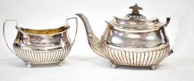 Lot 694 - A George III hallmarked silver matched part...