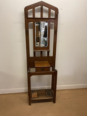 Lot 788 - An oak hall coat and umbrella stand with...