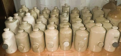 Lot 89 - Forty stoneware hot water bottles of various...