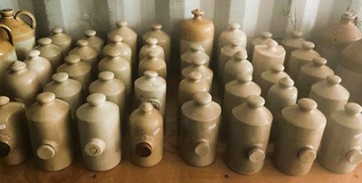 Lot 91 - Forty stoneware hot water bottles of various...