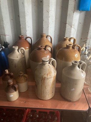 Lot 94 - Eleven stoneware flagons of various shapes and...