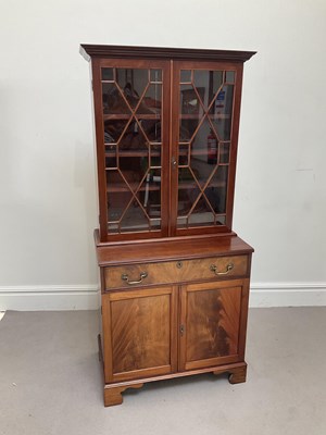 Lot 84 - A 19th century style mahogany bookcase, the...