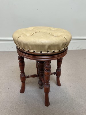 Lot 227 - A Victorian carved walnut adjustable piano stool.