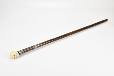 Lot 423 - An early 20th century carved ivory and bamboo...