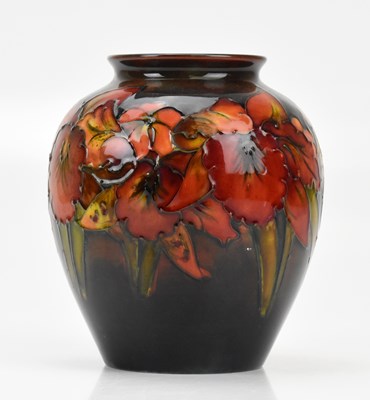 Lot 300 - WILLIAM MOORCROFT; an ovoid shaped vase in the...