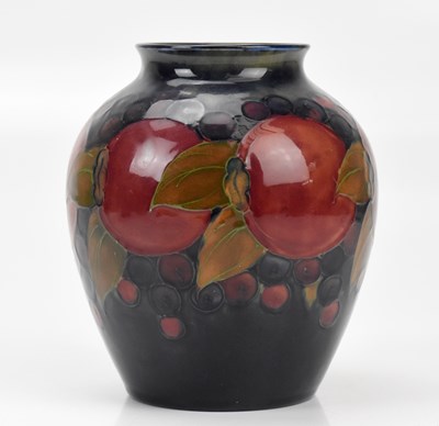 Lot 316 - WILLIAM MOORCROFT; a vase of ovoid form,...