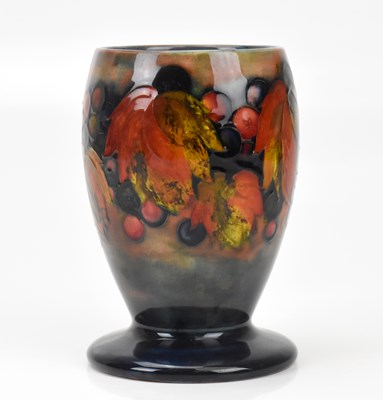Lot 317 - WILLIAM MOORCROFT; a flambé vase of footed...