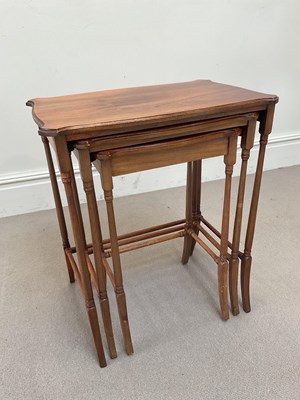Lot 1235 - An Edwardian nest of three mahogany coffee...