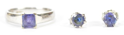 Lot 1122 - A tanzanite white metal ring, stamped 18ct,...