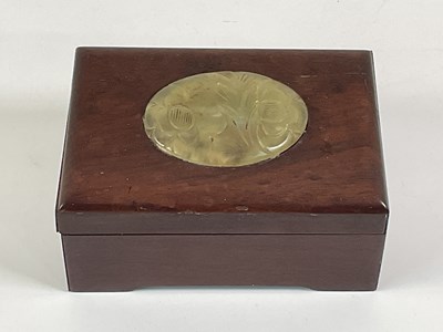 Lot 13 - A Chinese hardwood box with a carved jade...